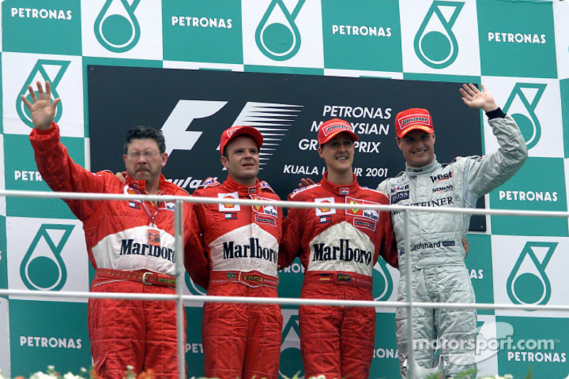 Ross Brawn, Rubens Barrichello, Michael Schumacher and David Coulthard on the podium