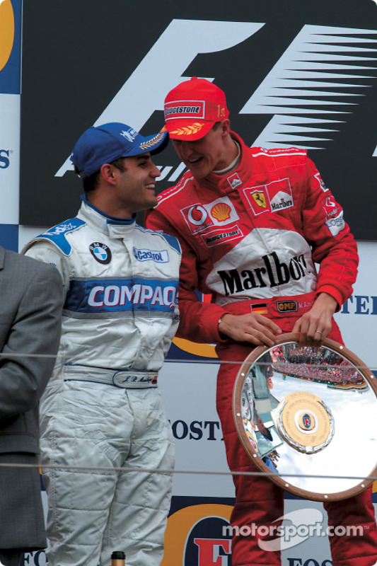 The podium: race winner Michael Schumacher with Juan Pablo Montoya