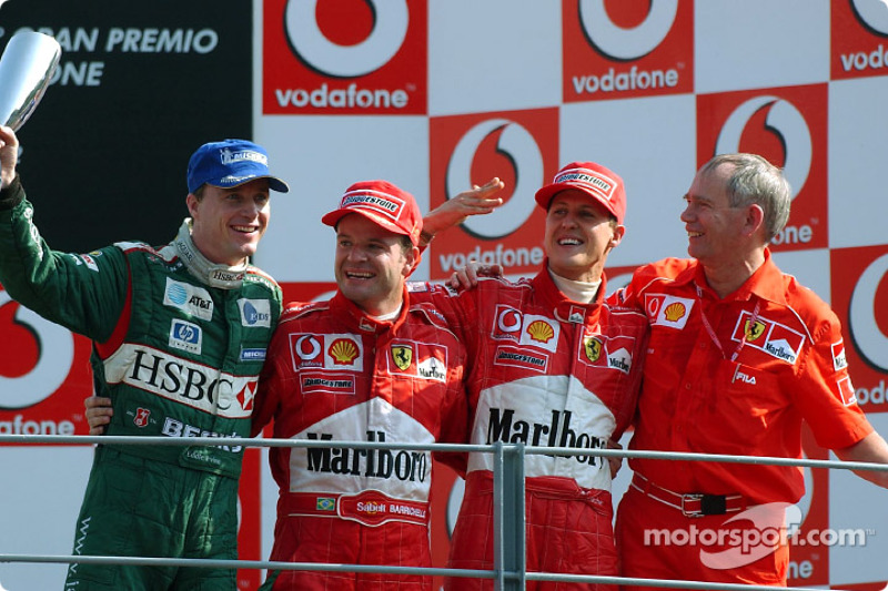 The podium: race winner Rubens Barrichello with Michael Schumacher and Eddie Irvine