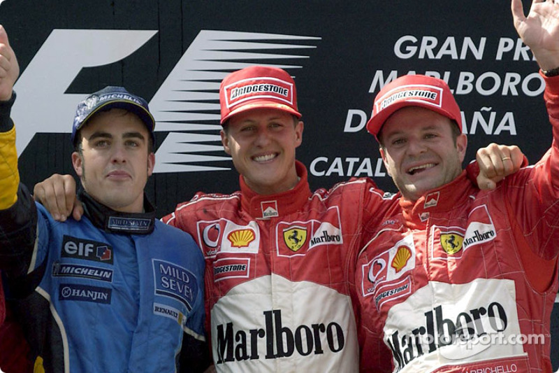 The podium: race winner Michael Schumacher with Fernando Alonso and Rubens Barrichello