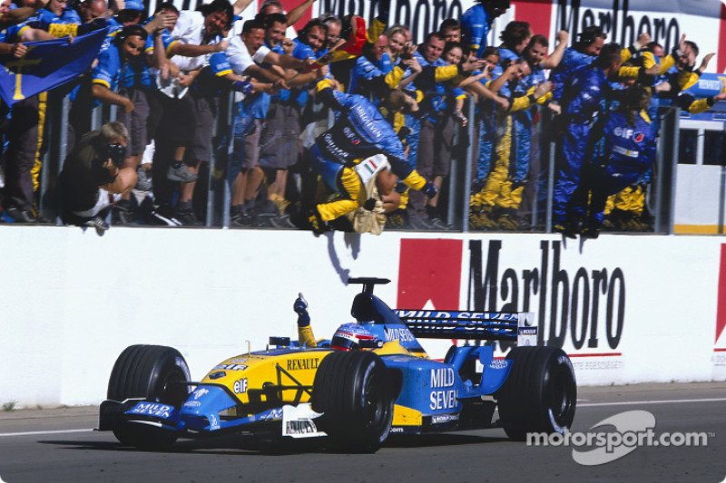 Race winner Fernando Alonso celebrates