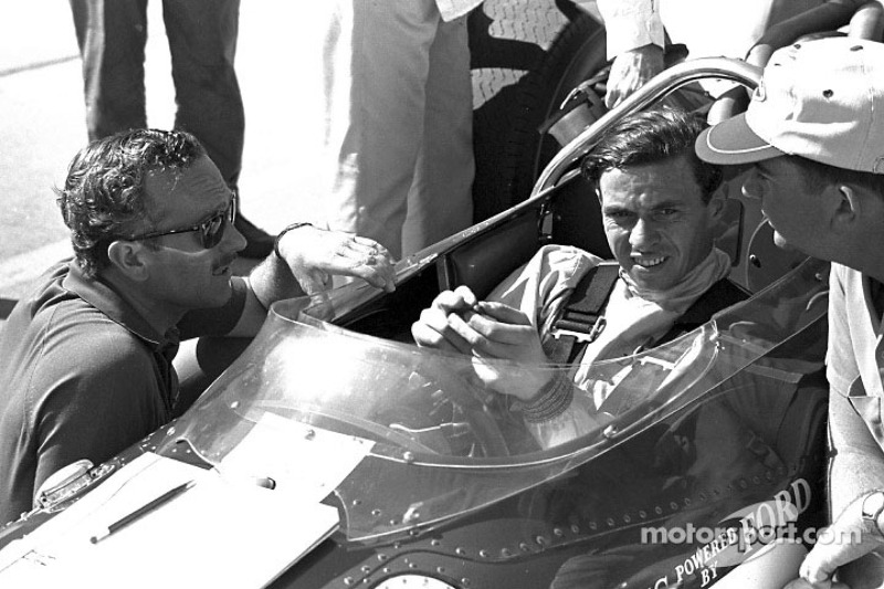 Jim Clark with Lotus designer Colin Chapman (in sunglasses)