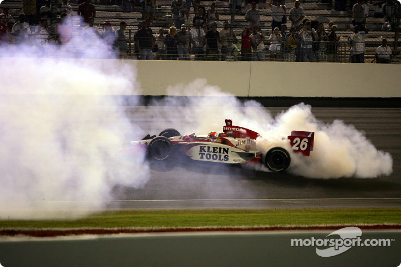 Dan Wheldon celebrates victory