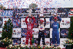 The podium: race winner Cristiano da Matta with Bruno Junqueira and Dario Franchitti