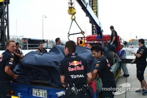 Sebastian Vettel, Red Bull Racing car is taken back to the pit lane