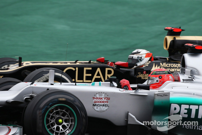 Michael Schumacher, Mercedes AMG F1 and Kimi Raikkonen, Lotus F1 battle for position