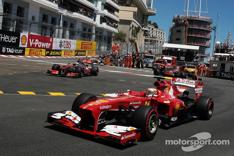 Fernando Alonso, Ferrari F138 passes through as Sergio Perez, McLaren MP4-28 runs wide at the chicane