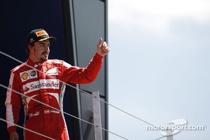 Fernando Alonso Ferrari celebrates his third position on the podium
