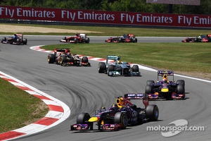 Sebastian Vettel, Red Bull Racing RB9 leads at the start of the race