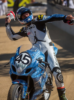Danny Eslick tossing his gloves into the crowd at the corkscrew