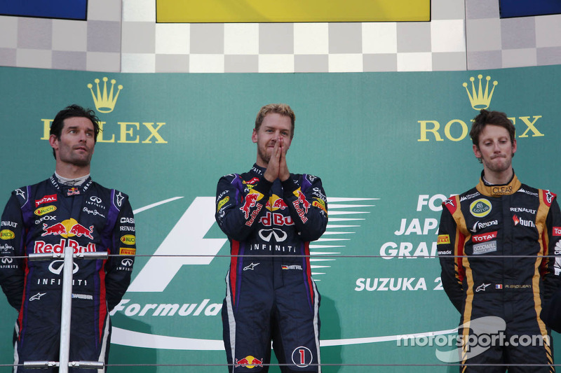 The podium: Mark Webber, Red Bull Racing, second; Sebastian Vettel, Red Bull Racing, race winner; Ro