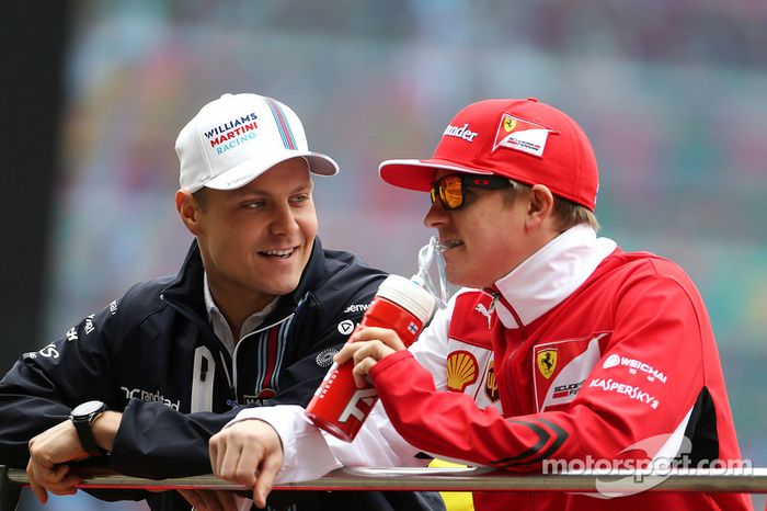 El noveno finlandés en F1. En la foto (2014), junto a Kimi Raikkonen