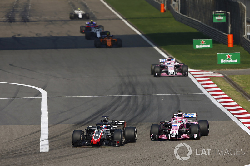 Romain Grosjean, Haas F1 Team VF-18 Ferrari, Esteban Ocon, Force India VJM11 Mercedes, and Sergio Perez, Force India VJM11 Mercedes