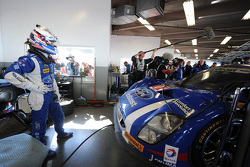 Joey Hand watches as his car is repaired