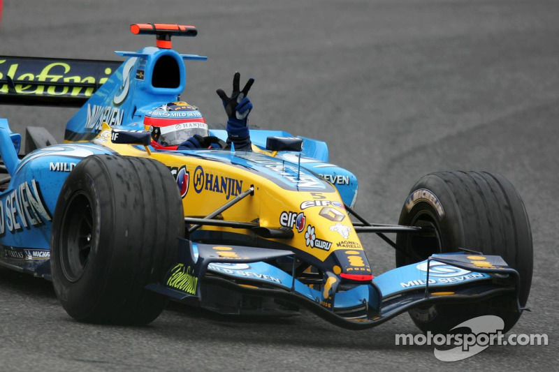 Race winner Fernando Alonso celebrates