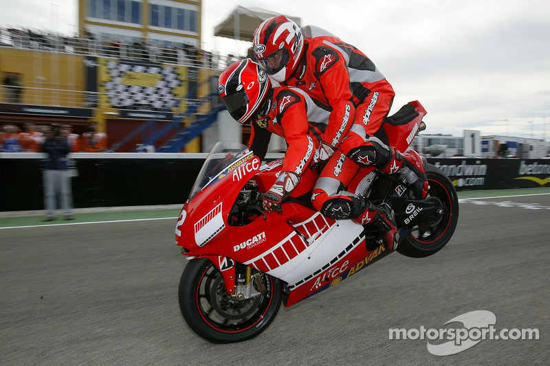 Gerhard Berger rides the Ducati MotoGP Desmosedici with Randy Mamola