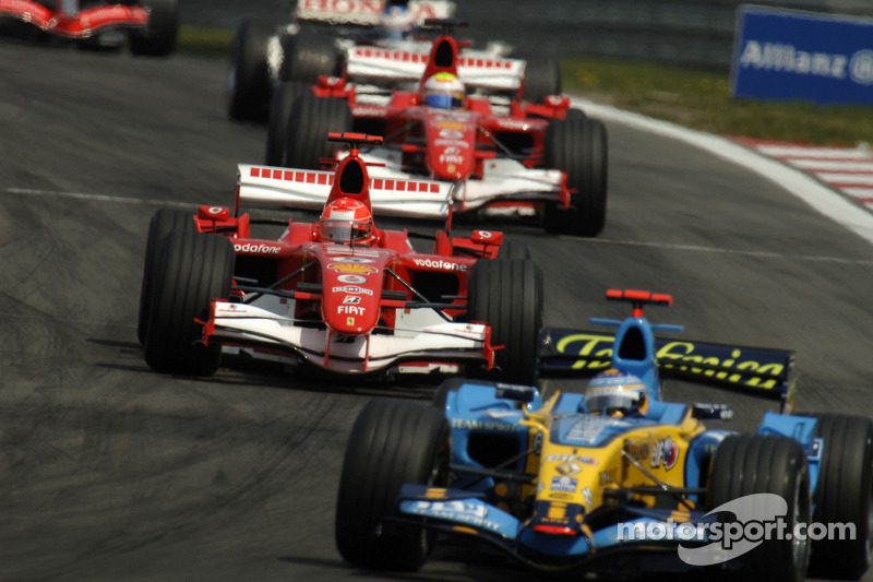 Fernando Alonso leads Michael Schumacher
