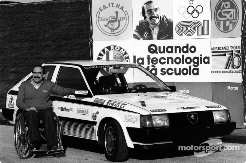 Clay Regazzoni in a wheel-chair at his Alfa Romeo sponsored racing driver school for handicapped peo