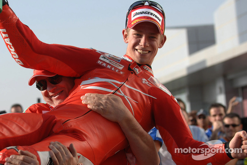 Race winner Casey Stoner celebrates