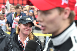 Sarah Fisher looks on as race winner Josef Newgarden, CFH Racing Chevrolet speaks to media