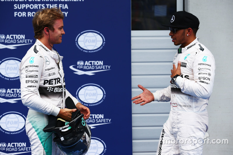 Second placed Nico Rosberg, Mercedes AMG F1 with team mate Lewis Hamilton, Mercedes AMG F1, who took