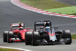 Fernando Alonso, McLaren MP4-30 leads Kimi Raikkonen, Ferrari SF15-T