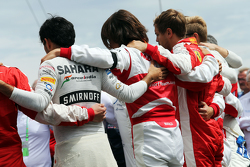 The drivers observe the tribute to Jules Bianchi on the grid