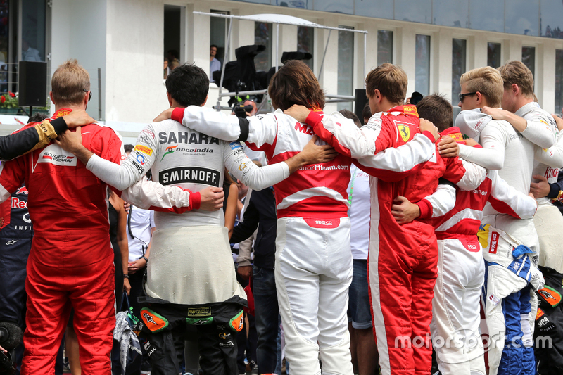 Drivers during minute of silence for Jules Bianchi