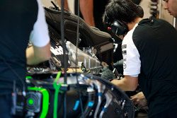 McLaren mechanics work on the McLaren MP4-30 of Fernando Alonso,