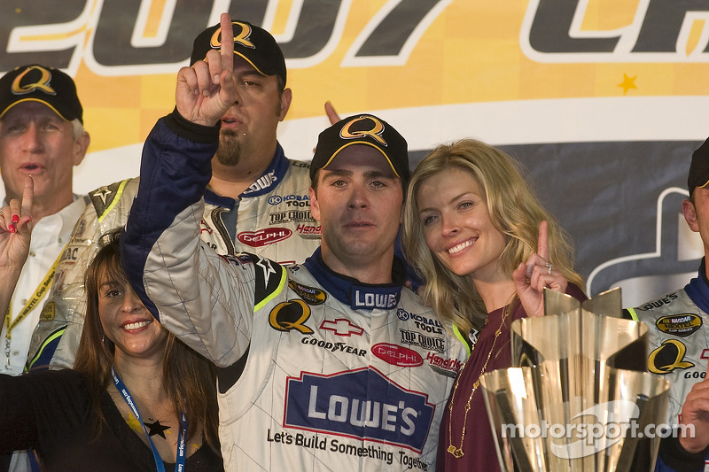 Championship victory lane: 2007 NASCAR Nextel Cup champion Jimmie Johnson celebrates with wife Chandra