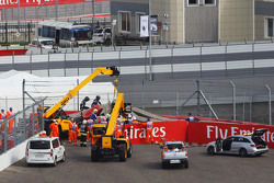 Carlos Sainz Jr., Scuderia Toro Rosso STR10 is extracted from the barriers after he crashed in the third practice session