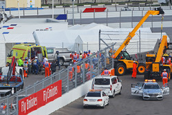 Carlos Sainz Jr., Scuderia Toro Rosso STR10 is extracted from the barriers after he crashed in the third practice session