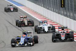 Felipe Nasr, Sauber C34 and Jenson Button, McLaren MP4-30