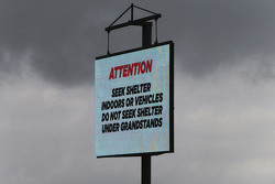 Heavy rainfall delays the start of FP2 as warning signs are displayed around the circuit