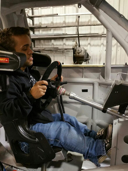Rico Abreu is fitted into a NASCAR truck
