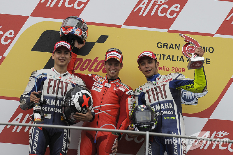 Podium: race winner Casey Stoner, second place Jorge Lorenzo, third place Valentino Rossi